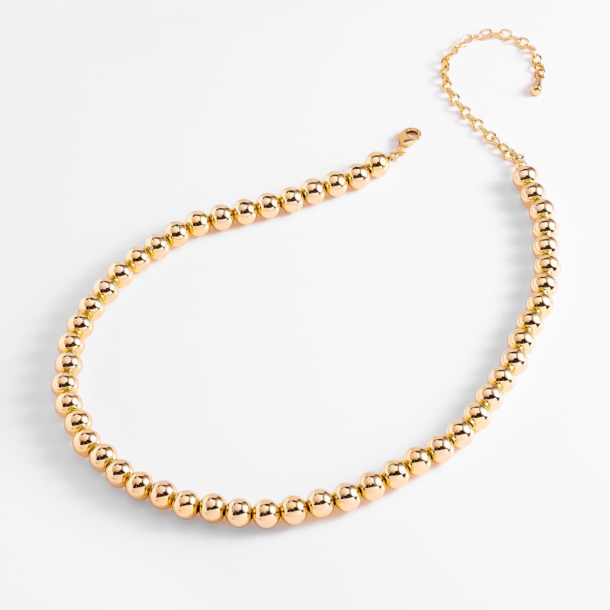 Collar en baño de oro con cuentas esféricas pulidas
