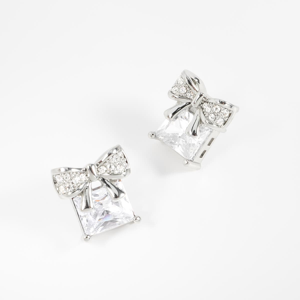 Aretes en baño de rodio moño piedra Diamonice toque brillante